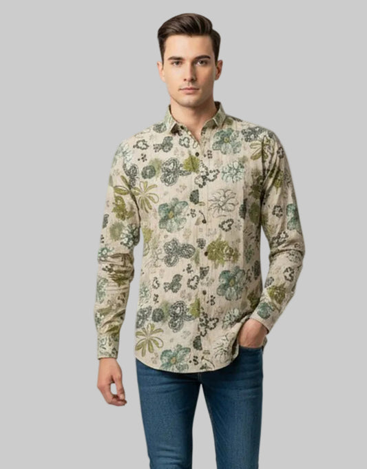 Man wearing a patterned shirt and jeans on a white background